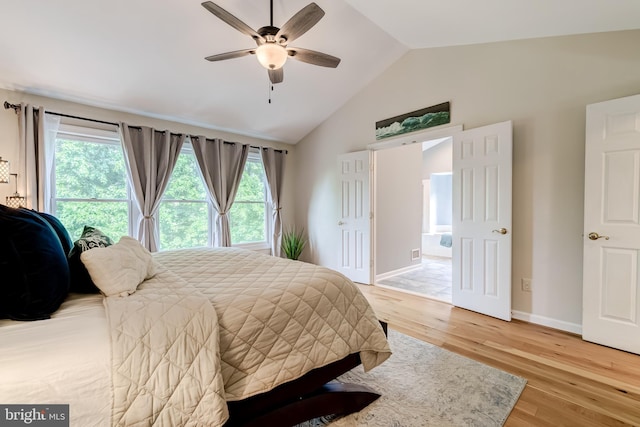 20932 Cox Mills Ct, Ashburn, VA 20147 - bedroom featuring multiple windows, light wood-style flooring, ceiling fan, and high vaulted ceiling