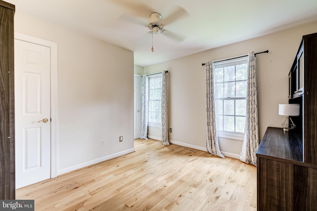 20932 Cox Mills Ct, Ashburn, VA 20147 - unfurnished bedroom featuring light wood finished floors and a ceiling fan