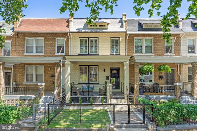 1716 M St NE, Washington, DC 20002 - multi unit property featuring brick siding, a gate, a porch, and mansard roof