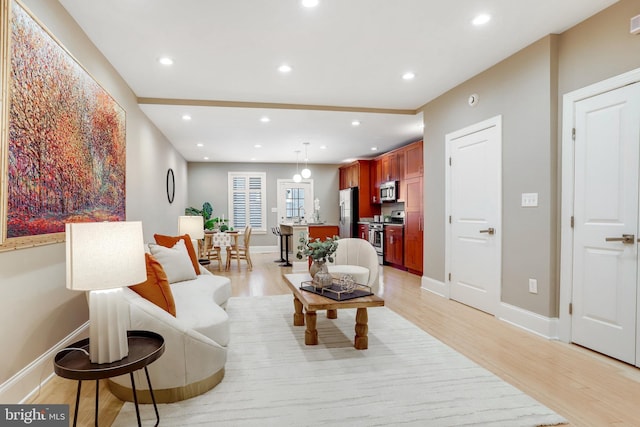 1716 M St NE, Washington, DC 20002 - living room featuring light wood-style floors, baseboards, and recessed lighting