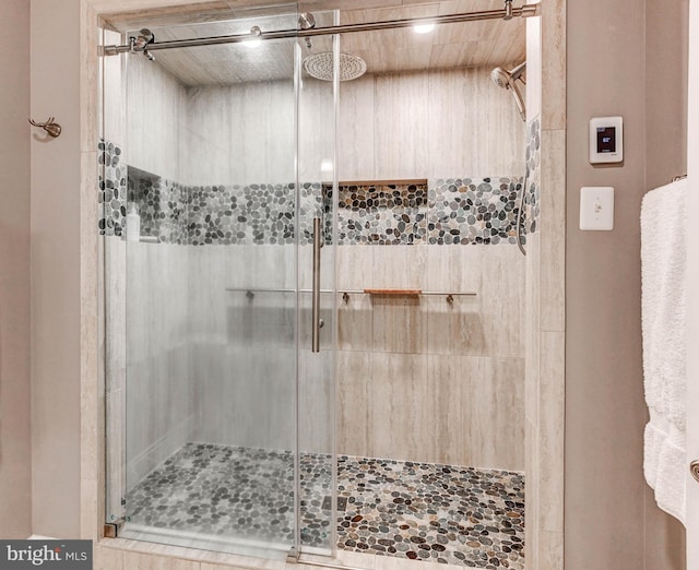 bathroom featuring a shower stall