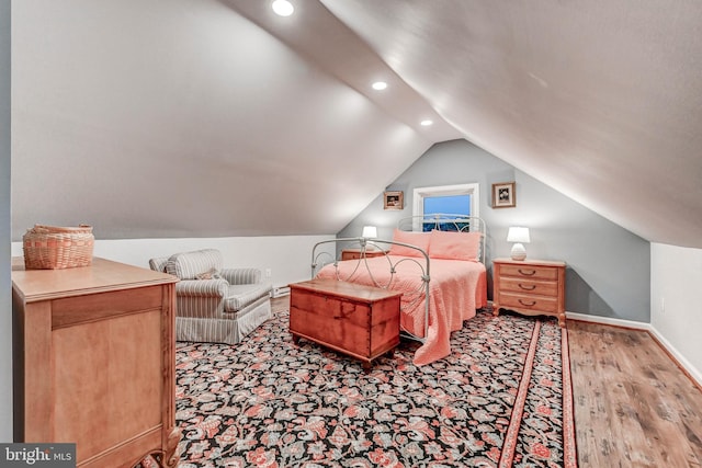 bedroom featuring recessed lighting, vaulted ceiling, light wood-style floors, and baseboards