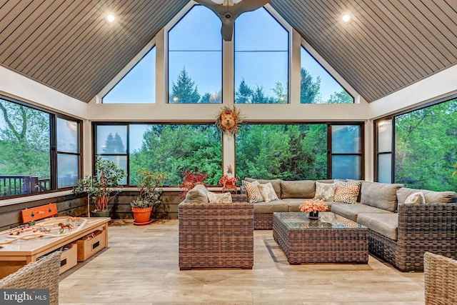 sunroom with high vaulted ceiling, healthy amount of natural light, wood finished floors, wooden ceiling, and recessed lighting