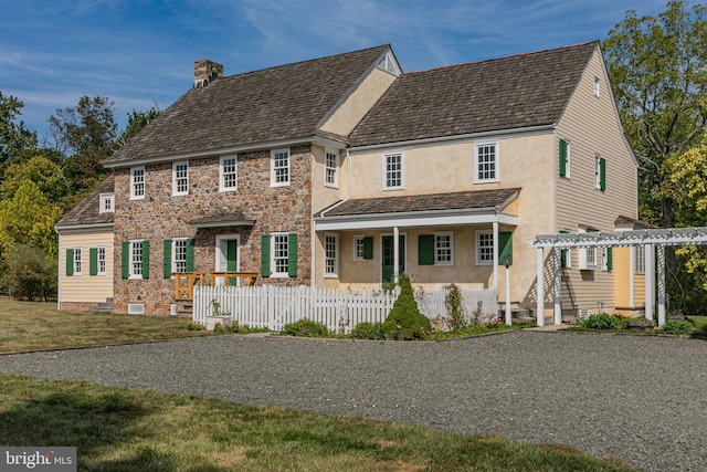 348 Rosemont Ringoes Rd, Stockton, NJ 08559 - view of front of home with a chimney, stucco siding, fence, and covered porch