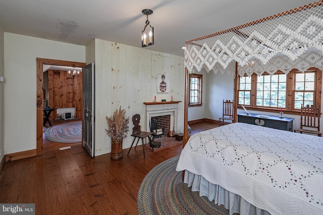 348 Rosemont Ringoes Rd, Stockton, NJ 08559 - bedroom with dark wood finished floors, a chandelier, and baseboards