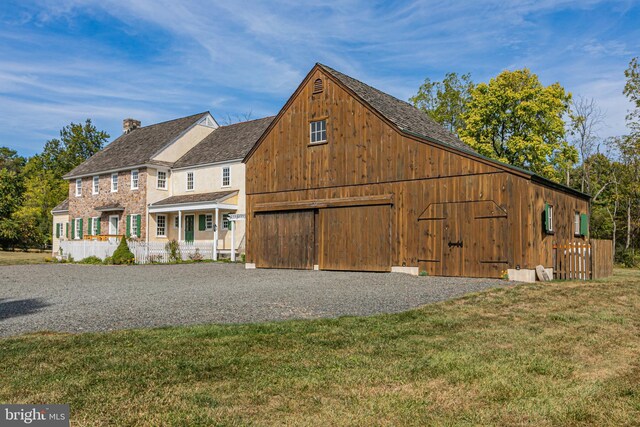 348 Rosemont Ringoes Rd, Stockton, NJ 08559 - view of front facade with driveway, a front lawn, a porch, a barn, and a garage