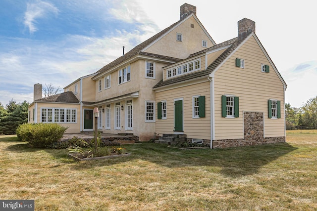 348 Rosemont Ringoes Rd, Stockton, NJ 08559 - back of house with a chimney, a lawn, and entry steps