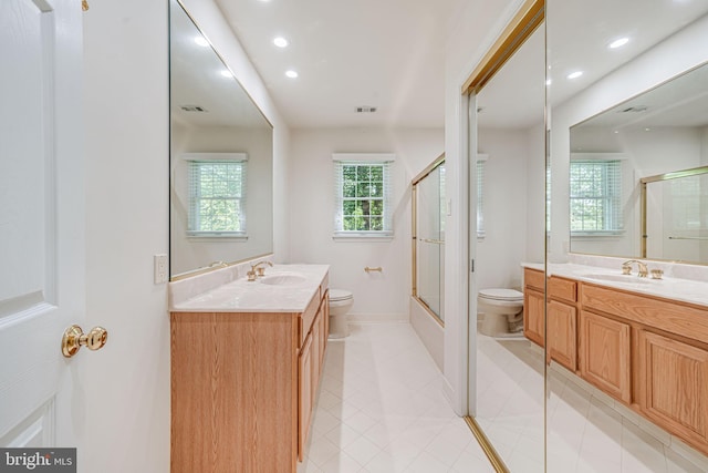 full bathroom with toilet, an enclosed shower, vanity, and recessed lighting
