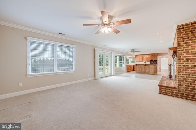 unfurnished living room with crown molding, a ceiling fan, baseboards, light carpet, and recessed lighting