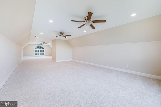 bonus room with lofted ceiling, ceiling fan, baseboards, light colored carpet, and recessed lighting