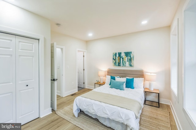 1129 8th St NE, Washington, DC 20002 - bedroom with light wood-style flooring, baseboards, a closet, and recessed lighting