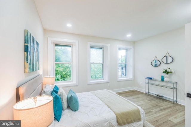 1129 8th St NE, Washington, DC 20002 - bedroom with wood finished floors, baseboards, and recessed lighting