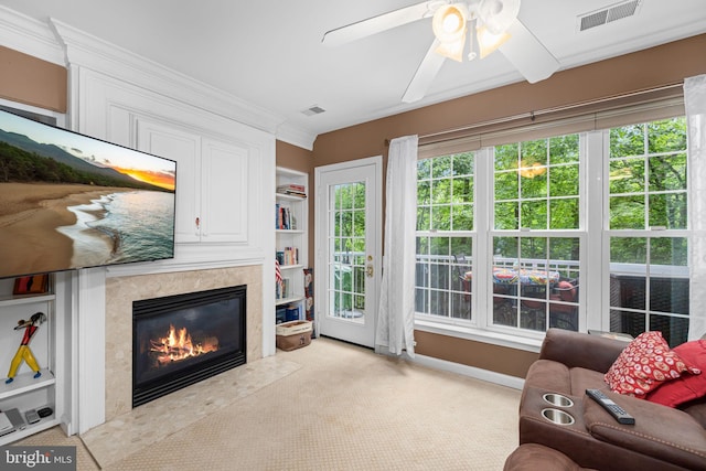 5942 Kimberly Anne Way, Alexandria, VA 22310 - carpeted living area with a premium fireplace, a ceiling fan, crown molding, and baseboards
