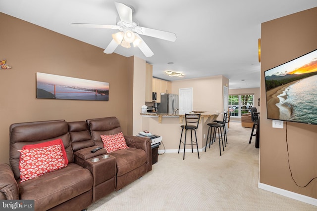 5942 Kimberly Anne Way, Alexandria, VA 22310 - living room featuring baseboards, light colored carpet, and a ceiling fan