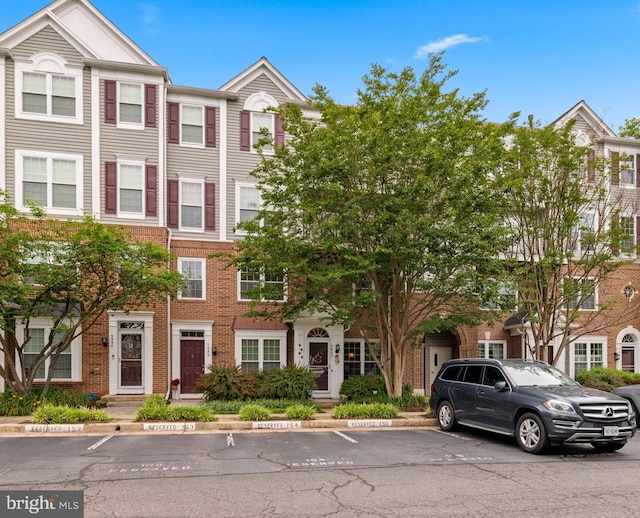 5942 Kimberly Anne Way, Alexandria, VA 22310 - view of property with uncovered parking and brick siding