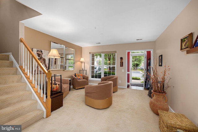 5942 Kimberly Anne Way, Alexandria, VA 22310 - living room with stairway, light colored carpet, and baseboards