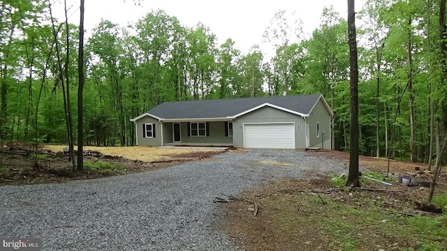 54 Hickory Ridge Rd, Newport, PA 17074 - ranch-style house featuring gravel driveway, an attached garage, and a porch