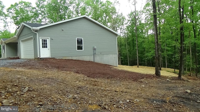 54 Hickory Ridge Rd, Newport, PA 17074 - view of property exterior with an attached garage and dirt driveway