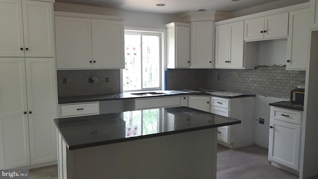 54 Hickory Ridge Rd, Newport, PA 17074 - kitchen with backsplash, a center island, white cabinetry, and dark countertops