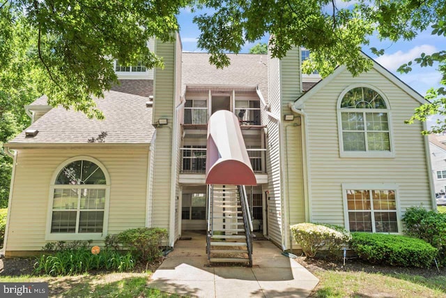 1013 Fallcrest Ct Unit 4-203, Bowie, MD 20721 - view of front of property with a chimney, stairs, and roof with shingles