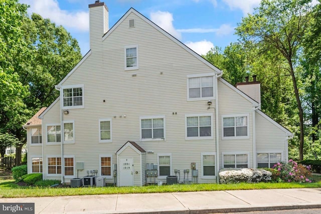 1013 Fallcrest Ct Unit 4-203, Bowie, MD 20721 - back of property with a chimney and cooling unit