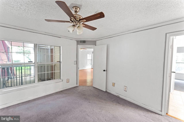 1013 Fallcrest Ct Unit 4-203, Bowie, MD 20721 - empty room with healthy amount of natural light, a ceiling fan, carpet, and a textured ceiling
