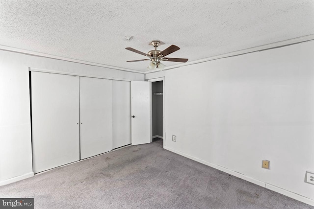 1013 Fallcrest Ct Unit 4-203, Bowie, MD 20721 - unfurnished bedroom featuring a textured ceiling, carpet flooring, ceiling fan, and baseboards