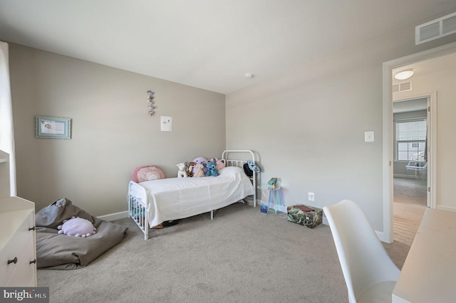 bedroom with carpet floors and baseboards
