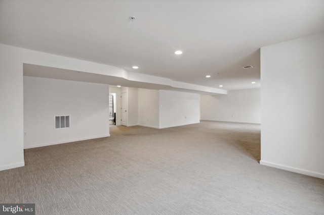 finished below grade area featuring recessed lighting, carpet, and baseboards