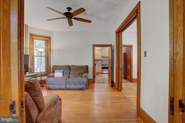 145 S Washington St, Greencastle, PA 17225 - living area featuring a ceiling fan, light wood-style flooring, and baseboards