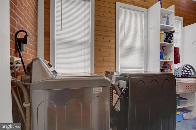 145 S Washington St, Greencastle, PA 17225 - washroom featuring washing machine and clothes dryer and wooden walls