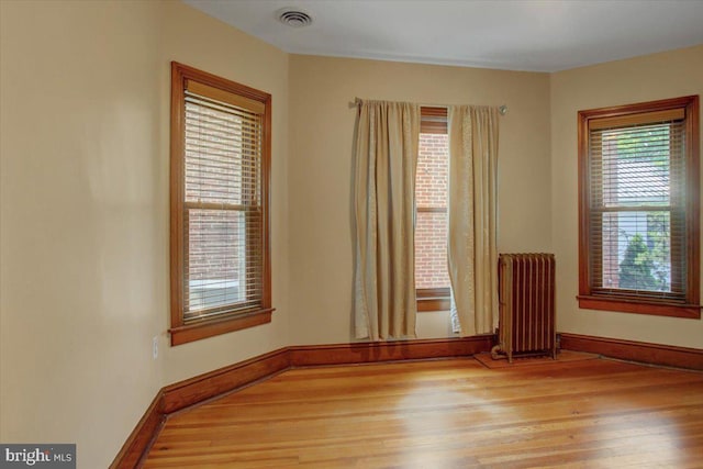 145 S Washington St, Greencastle, PA 17225 - unfurnished room featuring radiator, light wood-style floors, and baseboards