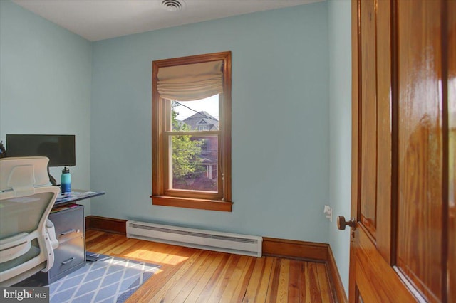 145 S Washington St, Greencastle, PA 17225 - home office featuring baseboard heating, light wood-style floors, and baseboards