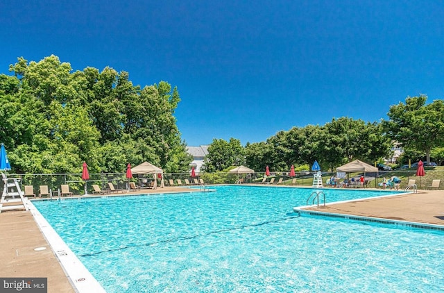 46245 Milthorn Ter, Sterling, VA 20165 - community pool featuring fence and a patio