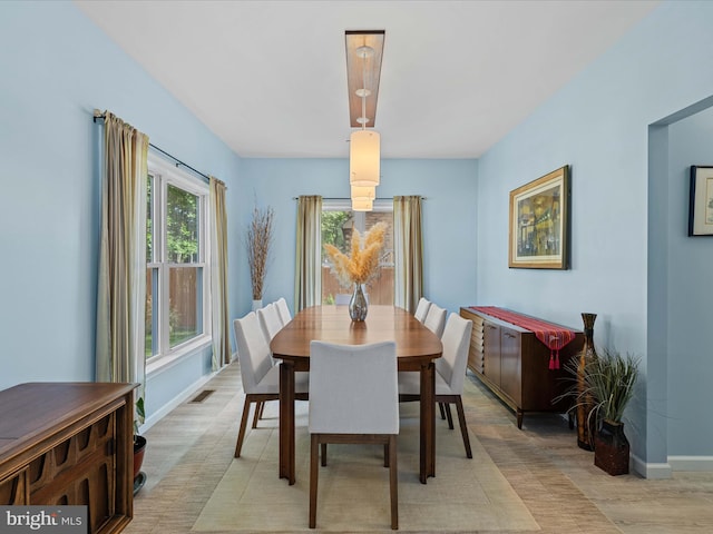 dining room with baseboards