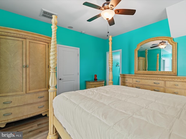 bedroom with wood finished floors and a ceiling fan