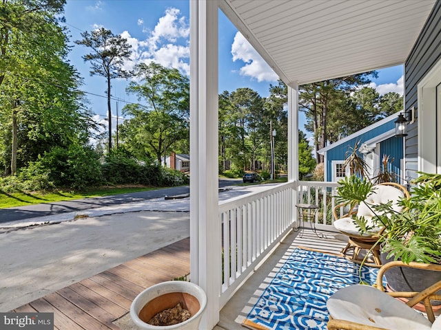 balcony featuring a porch