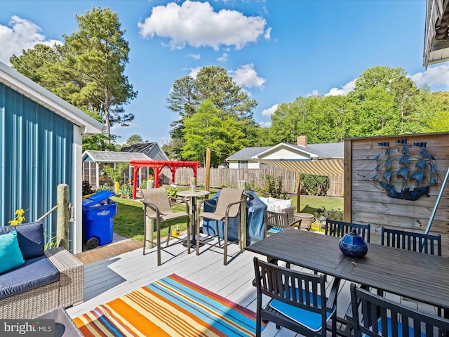 deck with outdoor dining space and an outdoor living space