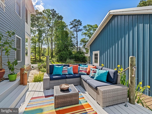wooden terrace with outdoor lounge area