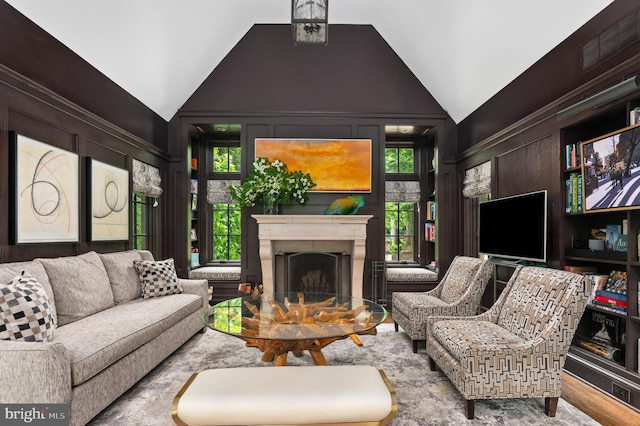 13312 Drews Ln, Potomac, MD 20854 - living room with lofted ceiling, a fireplace, and wood finished floors