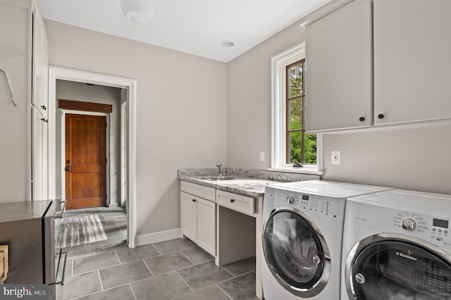 13312 Drews Ln, Potomac, MD 20854 - laundry room featuring washing machine and clothes dryer, cabinet space, baseboards, and tile patterned flooring