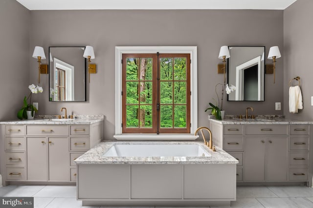 13312 Drews Ln, Potomac, MD 20854 - bathroom featuring tile patterned flooring, two vanities, and a garden tub