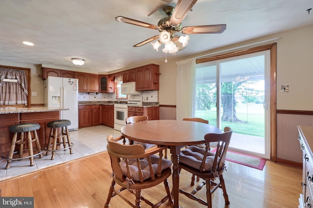 630 E Canal Rd, York, PA 17404 - dining space featuring ceiling fan, light wood-style flooring, wainscoting, and recessed lighting