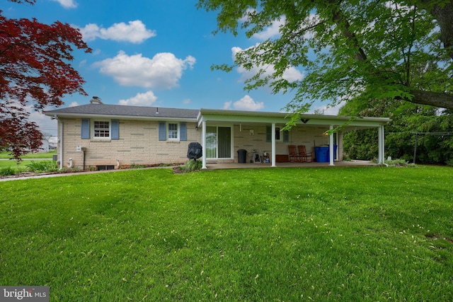 630 E Canal Rd, York, PA 17404 - back of property with a yard, brick siding, a patio area, and a chimney