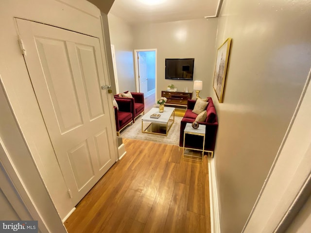 corridor with wood finished floors