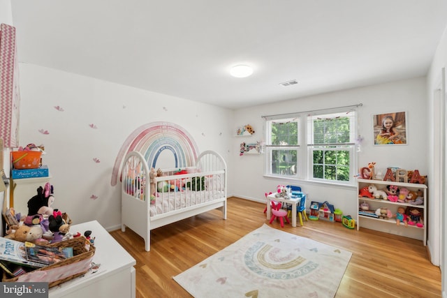bedroom with light wood-type flooring