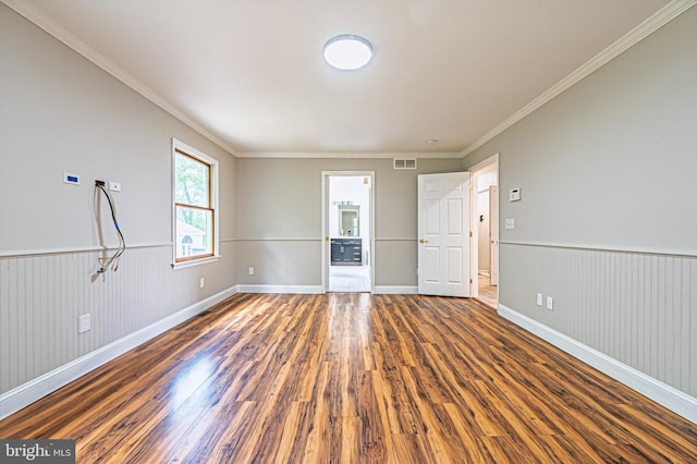 50 N Ave, Cedarville, NJ 08311 - empty room with wood finished floors, crown molding, wainscoting, and baseboards