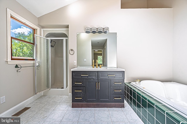 50 N Ave, Cedarville, NJ 08311 - bathroom with vaulted ceiling, a stall shower, healthy amount of natural light, vanity, and marble look tiles