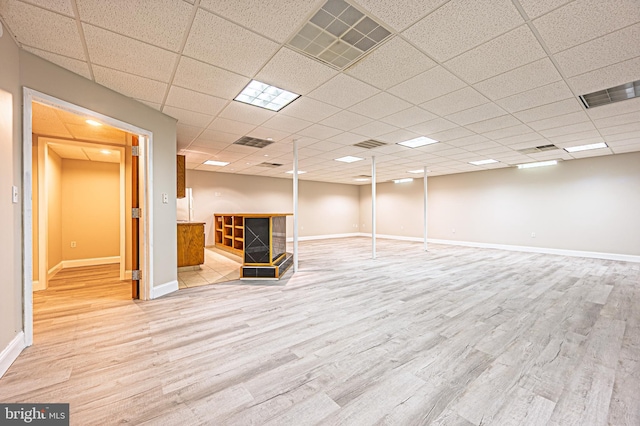 50 N Ave, Cedarville, NJ 08311 - finished below grade area with light wood finished floors, baseboards, a fireplace, and a drop ceiling