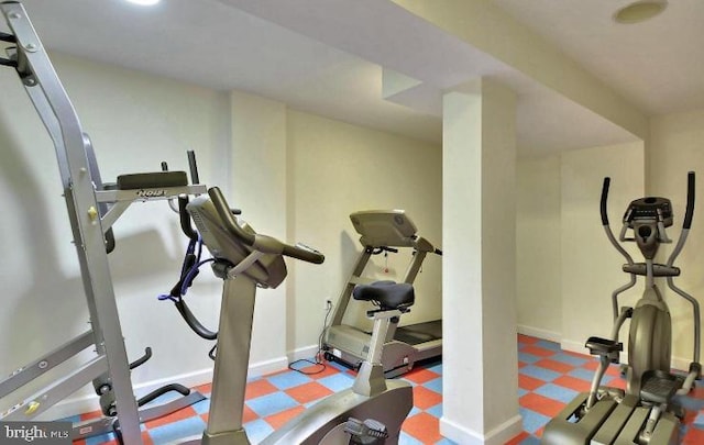 workout area with tile patterned floors and baseboards